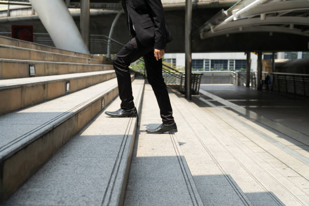 istock Business man walking on the stairs. 1154110491