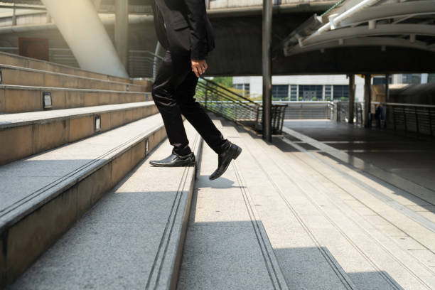 istock Business man walking on the stairs. 1154110517