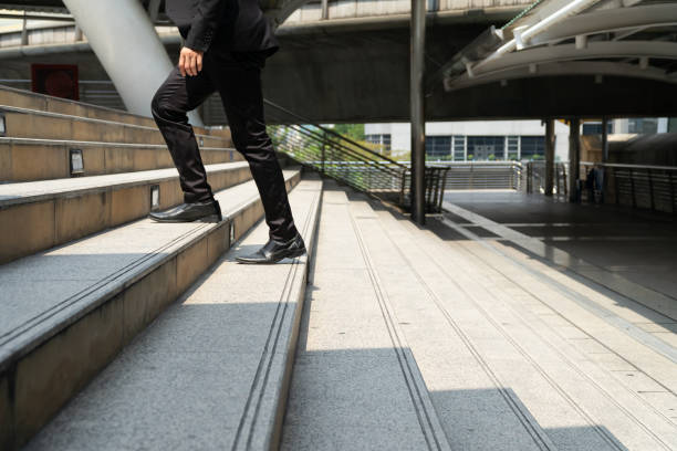 istock Business man walking on the stairs. 1154110531