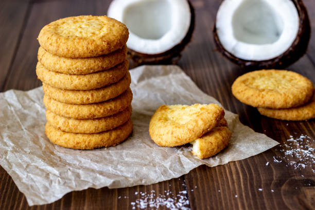 istock Coconut cookies on a brown wooden background. Coconuts. 1154111515
