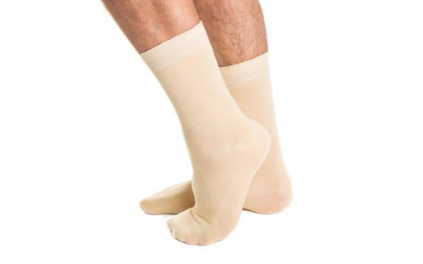 istock male legs in socks isolated 1154115275