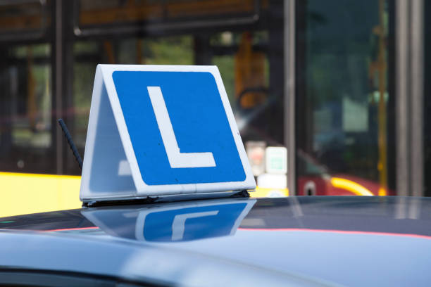 Polish driving school sign Rooftop sign showing the letter "L", meaning, in Poland that the driver is learning. driving licence stock pictures, royalty-free photos & images