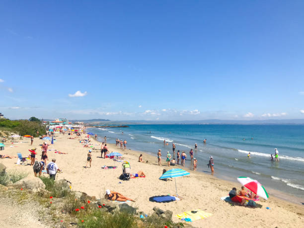 People Relaxing On The Beach. Pomorie, Bulgaria - June 05, 2019: People Relaxing On The Beach. pomorie stock pictures, royalty-free photos & images