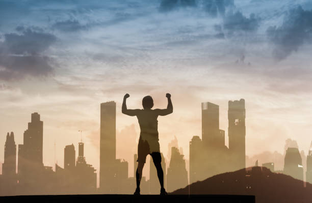 istock Strong, determined young man standing in the city with arms flexed 1154127002
