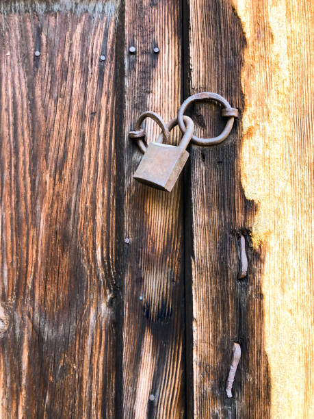 istock Old wooden door background close up 1154128382