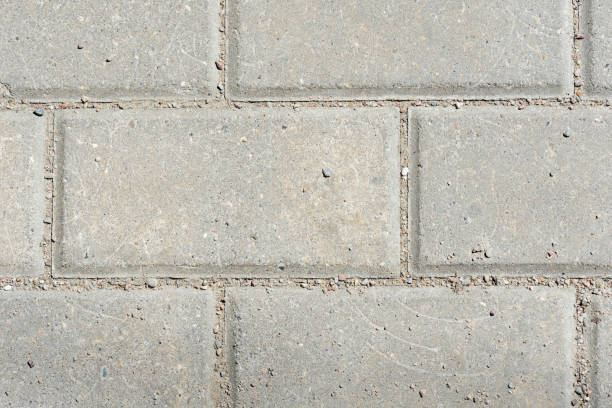 istock Gray paving slabs texture close up. Paving slabs background 1154128729