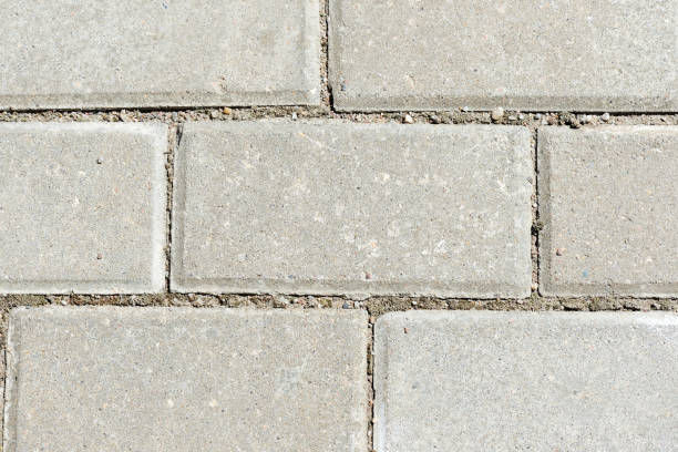 istock Gray paving slabs texture close up. Paving slabs background 1154128750