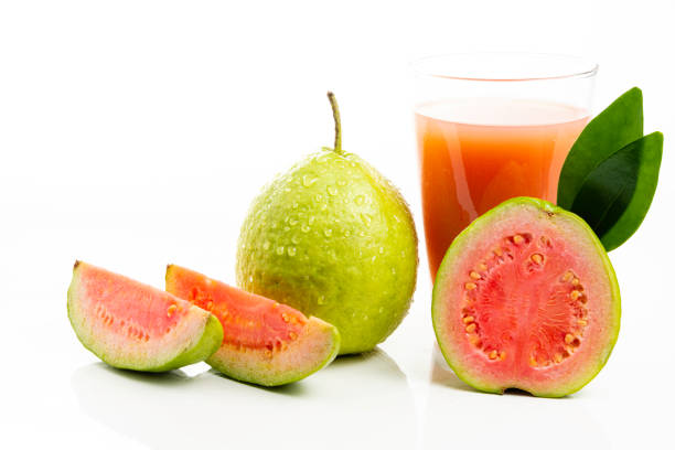 istock Guava juice and peeled fruit on white background 1154131152