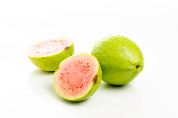 istock Red guava cut on white background 1154131160