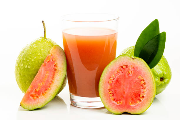 istock Guava juice and peeled fruit on white background 1154131253