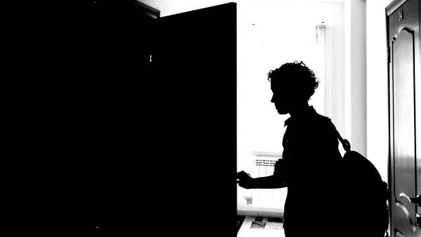 istock Woman opening the door 1154133260