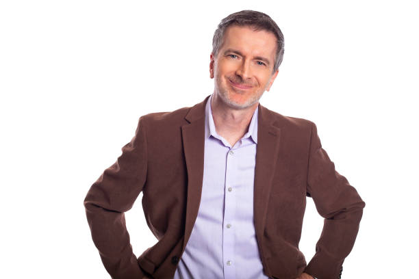 istock Middle Aged Businessman on a White Background Looking Happy and Smiling 1154134192