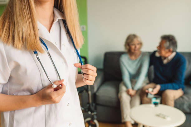 istock Smiling caregiver on a home visit 1154136287