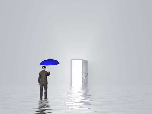 istock Man with umbrella in pure white room 1154138940