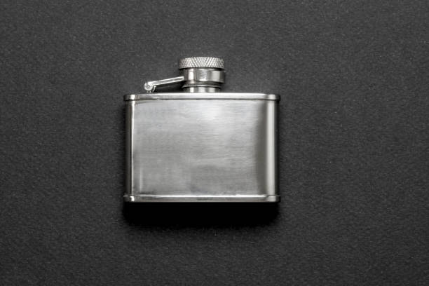 steel flasks flasks for drinks on black background hipflask stock pictures, royalty-free photos & images