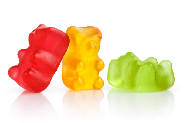 Gummy bears on white Colorful jelly gummy bears, isolated on white background chewy photos stock pictures, royalty-free photos & images