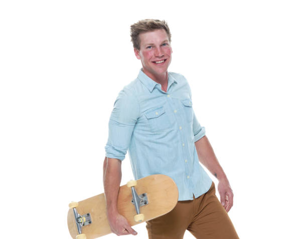 istock Casual well dressed man holding a skateboard 1154162419