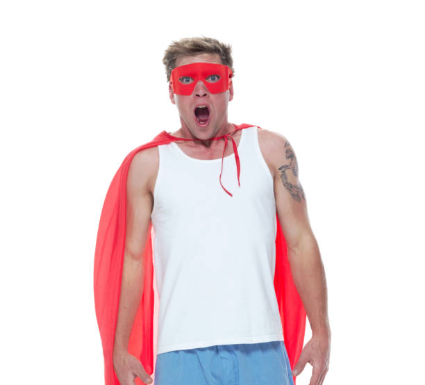 istock Man wearing pajamas and super hero cape 1154162605