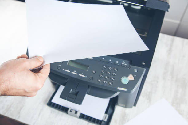 istock worker man with xerox in office 1154166195