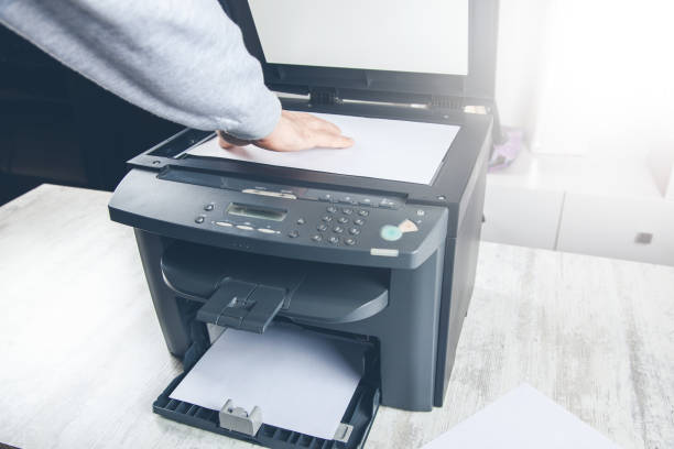 istock worker man with xerox in office 1154166213