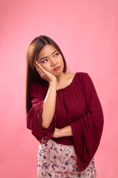 istock Beautiful young Asian woman get bored. 1154166898