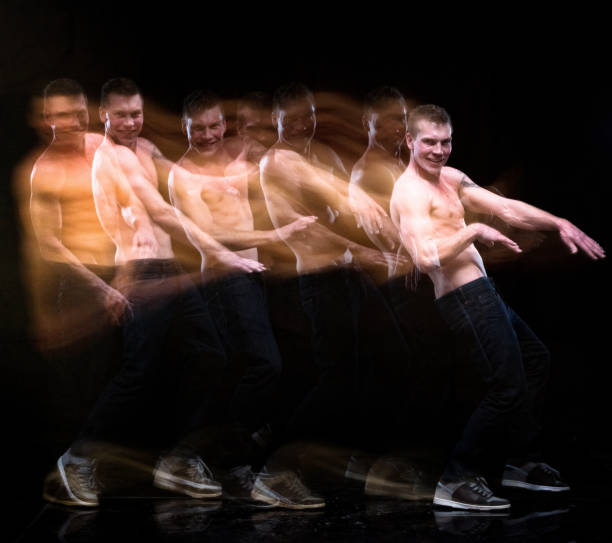 istock Shirtless man moving around with motion blur 1154171557