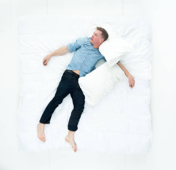 istock Above view of man resting in bed and sleeping 1154173058