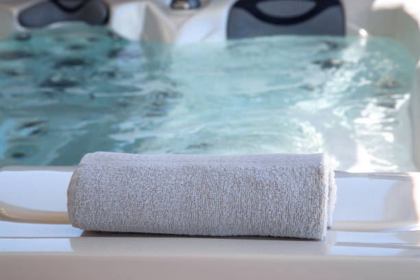 istock bath towel placed on the edge of a therapeutic spa 1154173515