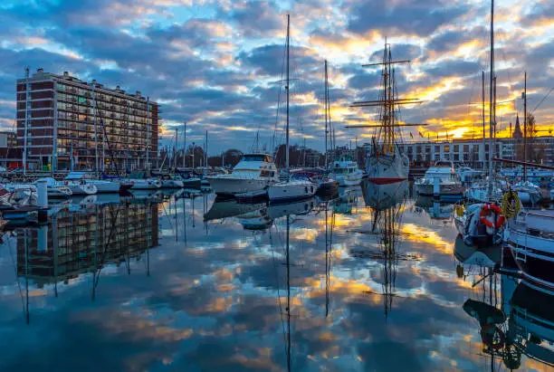 The yacht marina harbor at sunset in the city center of Ostend by the North Sea, Belgium.