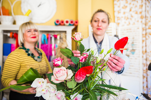 Two women working in a flower shop