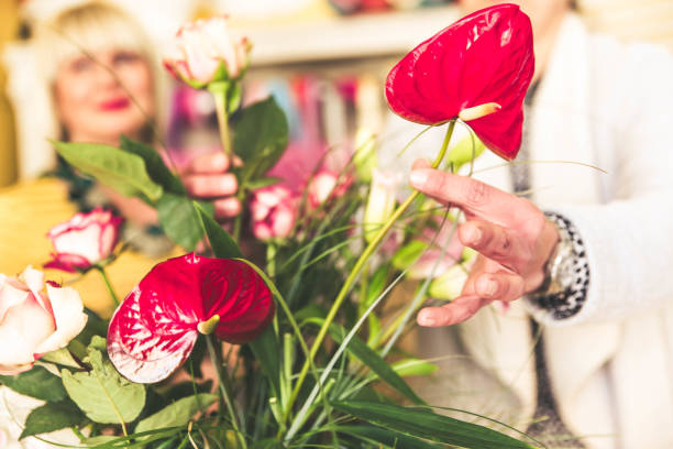 istock Working in flower shop on arranging flowers 1154201256