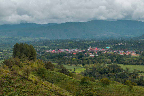 istock mountainous landscape with small town in the background 1154218588