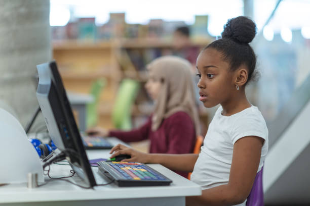 istock Smiling computer girl portrait 1154220442