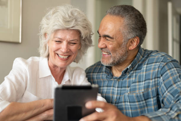 istock Senior couple using electronic tablet to video chat 1154221320
