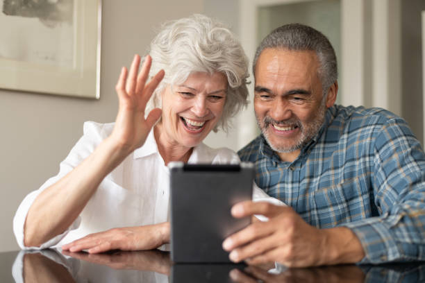 istock Senior couple using electronic tablet to video chat 1154221834