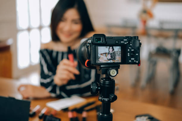 istock beauty blogger live broadcasting cosmetic makeup tutorial on social media. 1154223593
