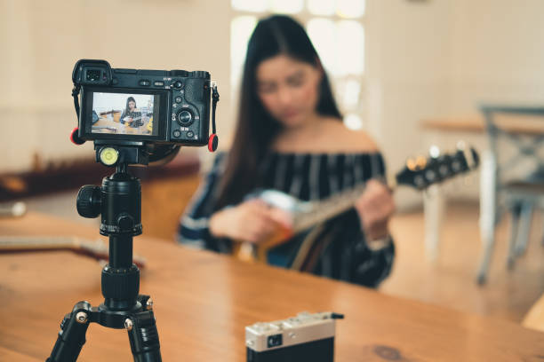 istock blogger live broadcasting music instrument tutorial on social media. vlogger recording online vlog video. 1154223644