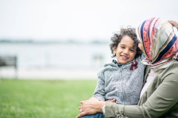 istock A mother and son sit in the park 1154230008