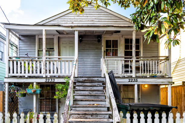 Old Dauphine street district in Louisiana famous town with antique house New Orleans, USA - April 22, 2018: Old Dauphine street district in Louisiana famous town with antique house drab stock pictures, royalty-free photos & images