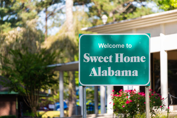 Highway road in Alabama with welcome sign on street with nobody and sweet home text in visitor center stock photo
