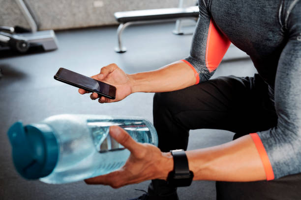 istock Sportsman checking smartphone 1154249199