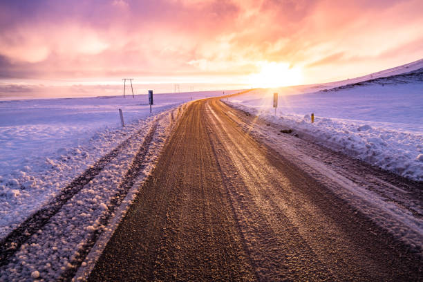 istock Winter sunset view on the road trip 1154254818