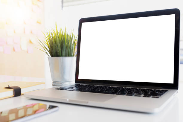 istock Blank screen Laptop computer and poster workspace background in modern office 1154255448