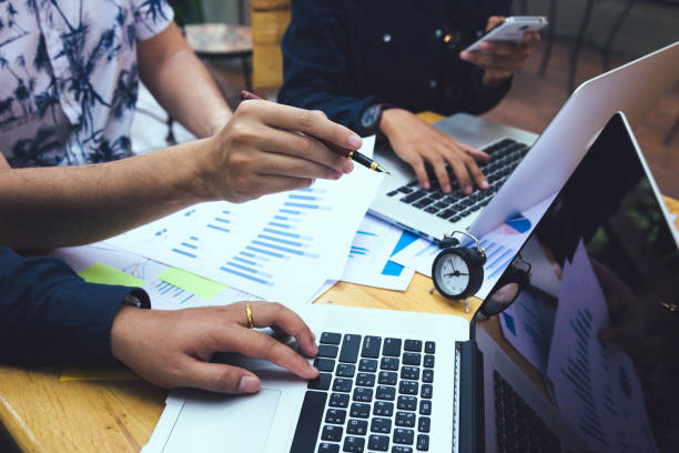 istock Team business people analysis summary report graph on laptop in office room. 1154266540