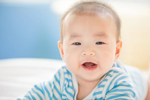 istock baby lying on the bed 1154268648