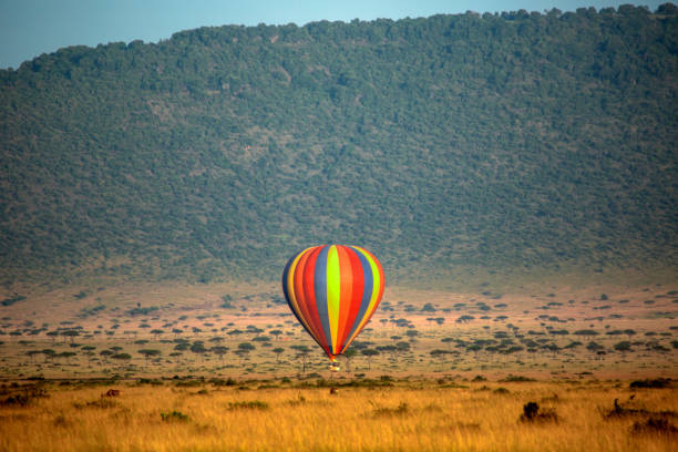 istock Hot-air balloon in savanna, Kenya 1154271697