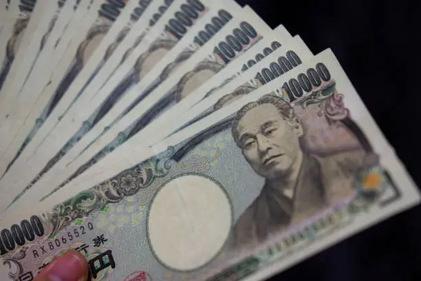 Photo of Counting JPY(Japanese Yen) 10,000 banknotes
