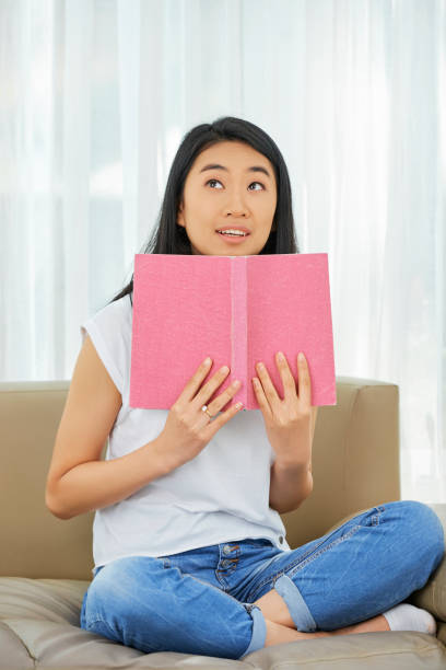 istock Dreamy girl with opened book 1154281194