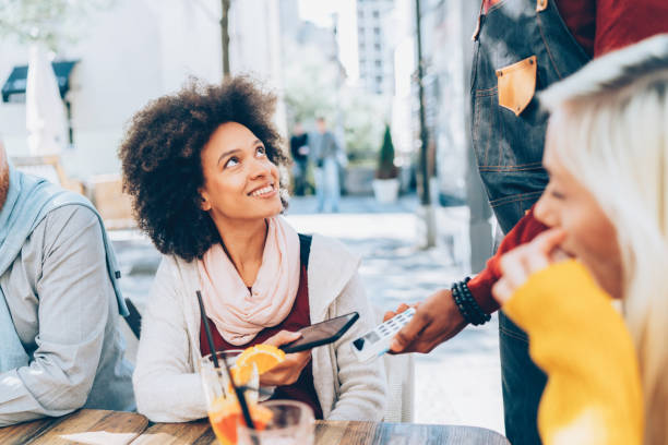 istock Woman paying contactless 1154282588