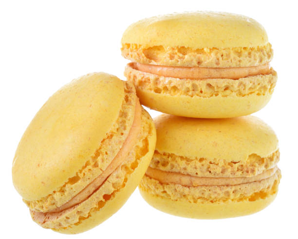 istock Yellow peach macaroon close up isolated 1154289405